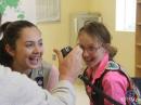 “Talk about excitement!” In Raymond, New Hampshire, Girl Scouts Kacilynn (left) and Caroline talk to the world, with supervision from Bruce Blain, K1BG. [KD1SM photo]